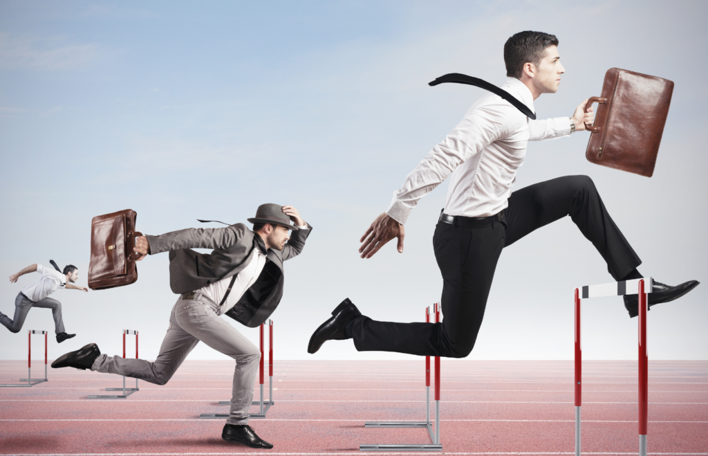 Business man running holding laptop